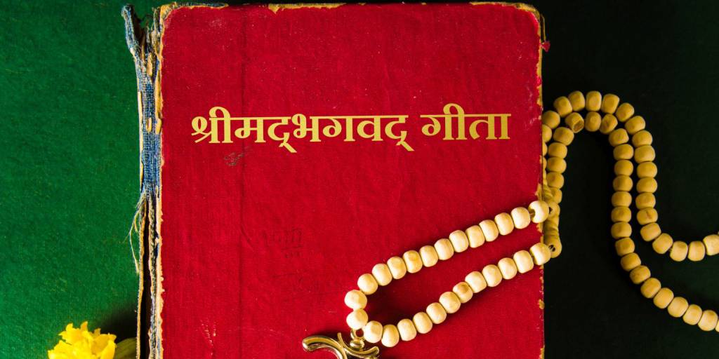 Holy scriptures with Aum symbol